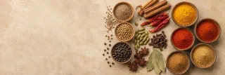 Whole spices vs ground spices arranged for cooking comparison